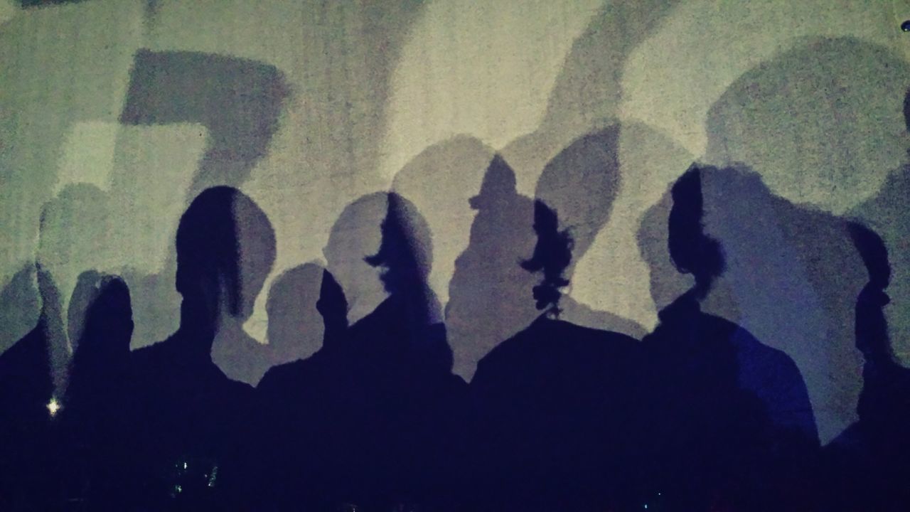 CLOSE-UP OF PEOPLE SHADOW ON THE FLOOR