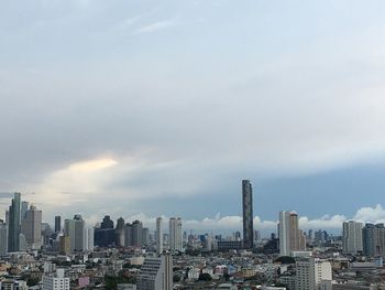 Modern buildings in city against sky