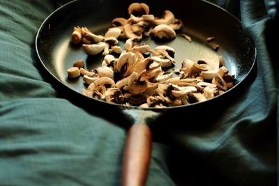 Close-up of mushrooms in cooking pan