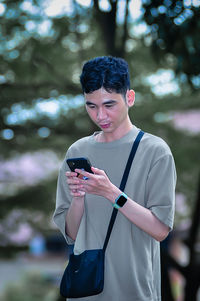 Young man using mobile phone