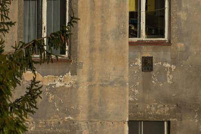 Abandoned building seen through window