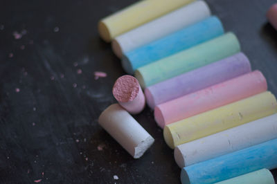 Close-up of colorful chalks on table