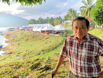 Portrait of man standing on land