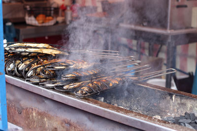 Close-up of fish on barbecue grill