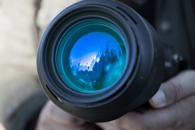 Close-up of hand holding camera