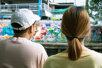 Rear view of couple in park