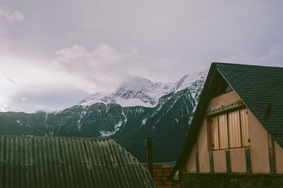 Scenic view of snow covered mountain against sky