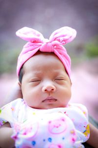 Close-up of cute baby girl with bandana