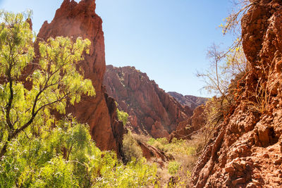 Scenic view of mountains against clear sky during sunny day