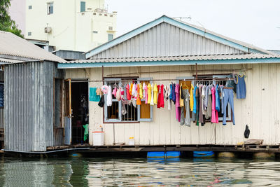 Clothes hanging to dry on the mekong river, vietnam. multi-colored.