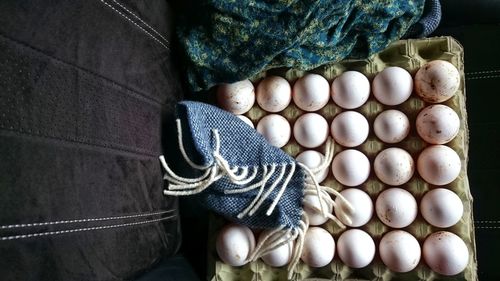 High angle view of eggs in carton