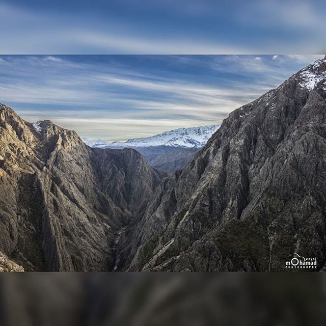 mountain, mountain range, sky, scenics, tranquility, tranquil scene, beauty in nature, nature, landscape, cloud - sky, non-urban scene, cloud, rocky mountains, snow, tree, day, rock - object, rock formation, idyllic, outdoors