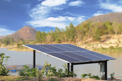 Solar panels for pumping water supply beside the reservoir in rural area