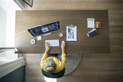 Woman in office using computer