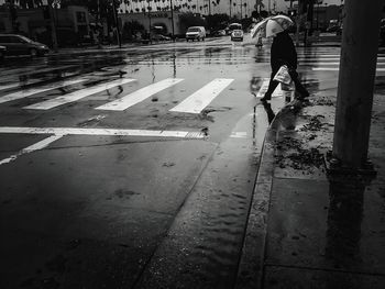 Woman walking on road