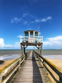 Pier over sea against sky