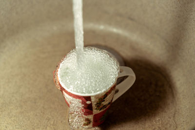 High angle view of coffee cup on table