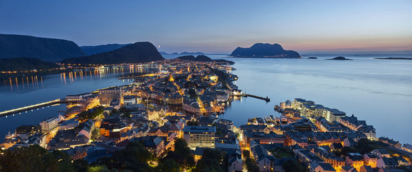 Cityscape view with sea at dusk