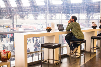 People working on table at home