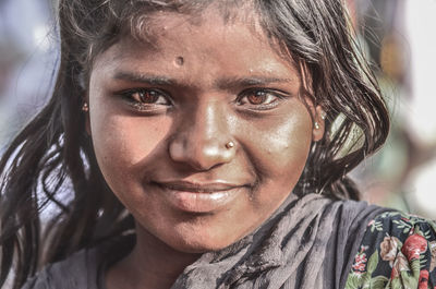 Close-up portrait of smiling teenage girl