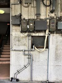 Low angle view of telephone mounted on wall