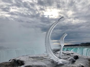 Scenic view of frozen lake against sky