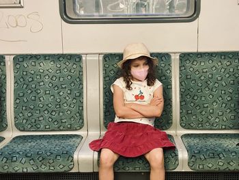 Girl in train with mask