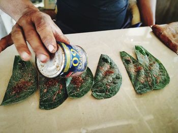 Midsection of man preparing food