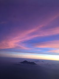 Scenic view of dramatic sky over sea during sunset