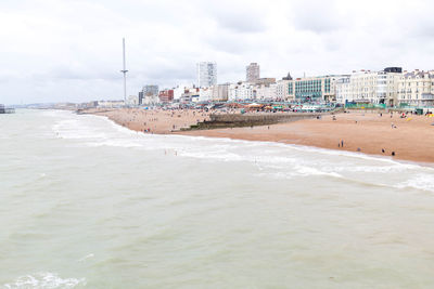 View of beach with city in background