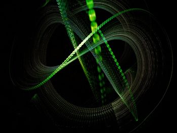 Close-up of illuminated lights against black background