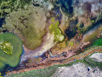 High angle view of multi colored rocks in water