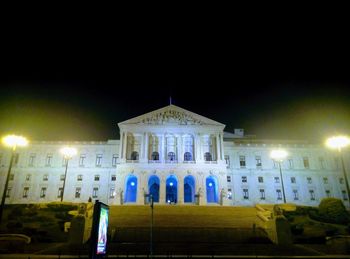 Low angle view of illuminated building at night