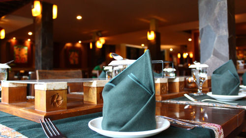 Empty chairs and tables in restaurant