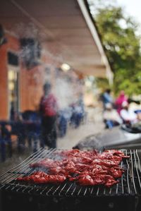 Close-up of meat on barbecue grill