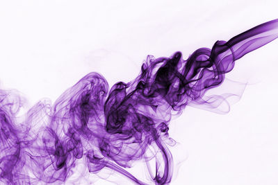 Close-up of abstract smoke pattern against white background