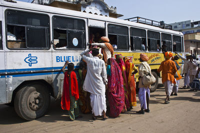 Rear view of people on street