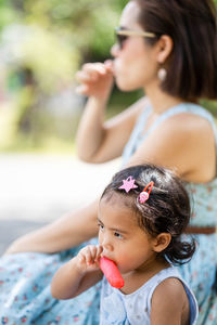 Mother and daughter eating ice cream