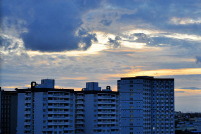 View of residential buildings against sky