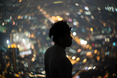 Woman standing at night