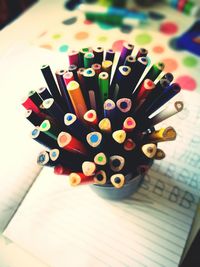 Close-up of multi colored pencils on table