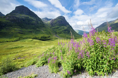 Scenic view of mountains against cloudy sky