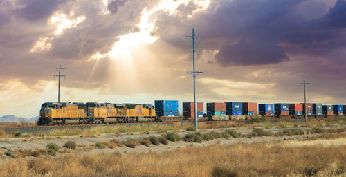 Train on field against sky