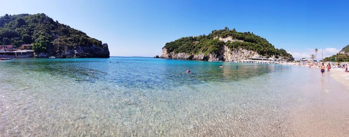 Scenic view of sea against clear blue sky