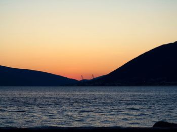 Scenic view of sea against clear sky during sunset