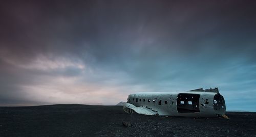 Scenic view of landscape against cloudy sky