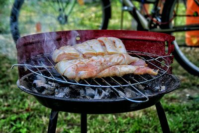 Close-up of meat on barbecue grill