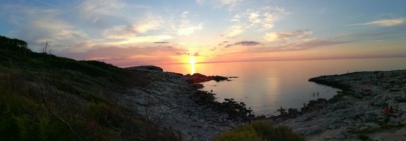 Panoramic view of sea against sky during sunset