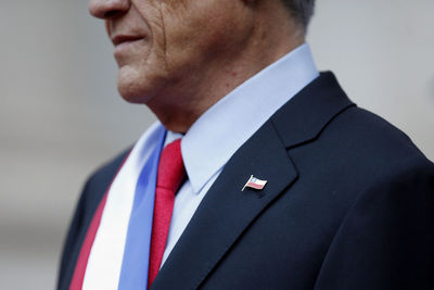 Close-up of midsection mature man with chilean flag