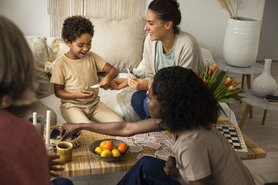 Family playing cards at home